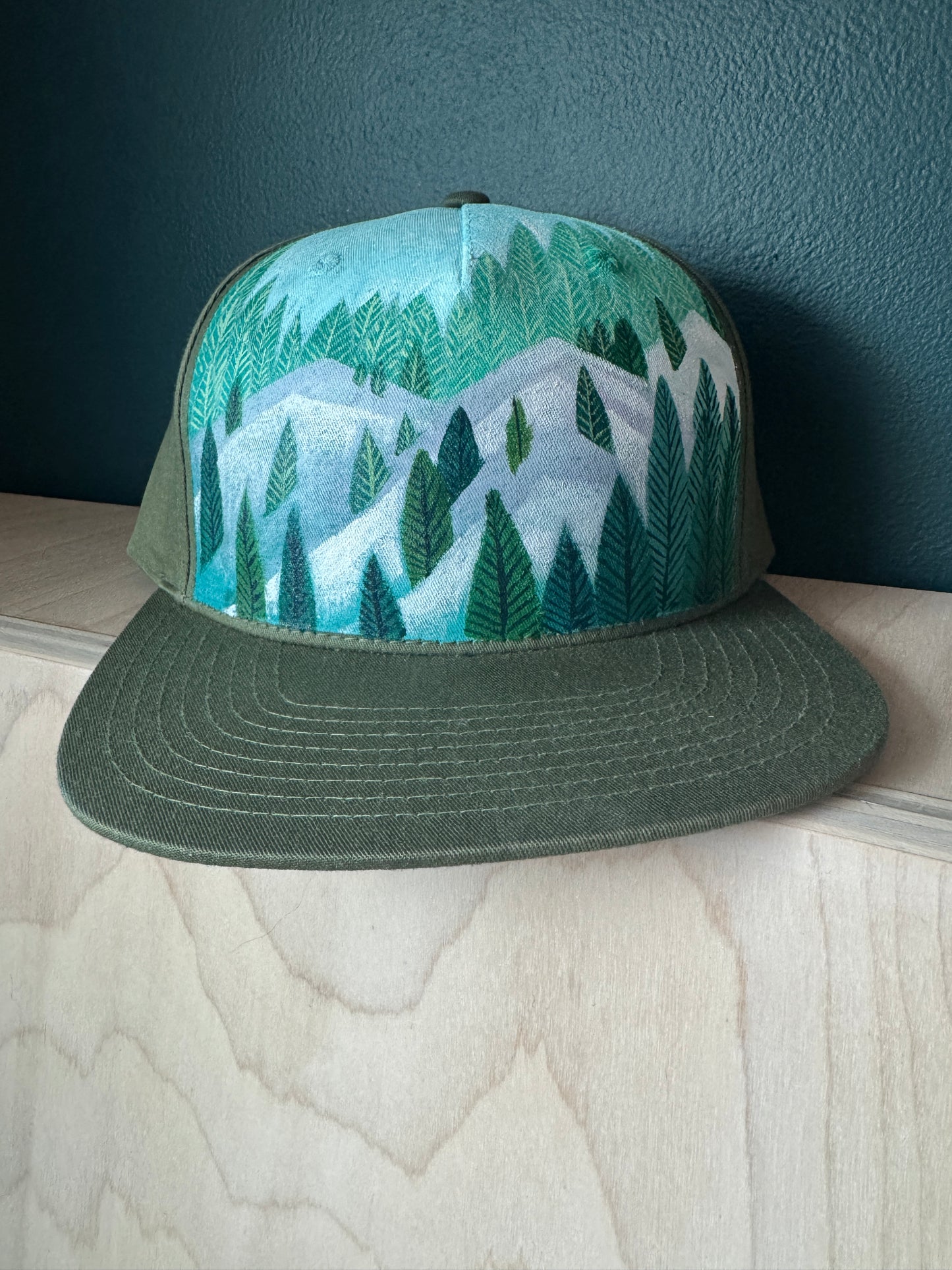 "Snowy Treeline on Olive Green" Hand Painted Hat